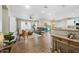 Open concept living room and kitchen with hardwood floors at 15996 W Mesquite Ct, Surprise, AZ 85374