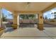 Covered patio overlooks a gravel backyard with desert landscaping at 19504 N 88Th Dr, Peoria, AZ 85382
