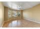 Bright living room with hardwood floors and a bay window at 19504 N 88Th Dr, Peoria, AZ 85382