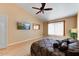Main bedroom features hardwood floors, large window, and ceiling fan at 19504 N 88Th Dr, Peoria, AZ 85382