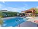 Inviting backyard oasis with a sparkling pool and pergola at 21187 E Alyssa Rd, Queen Creek, AZ 85142