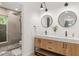 Modern bathroom with double vanity and large walk-in shower at 2343 E Cholla St, Phoenix, AZ 85028