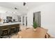 Modern kitchen with an island, breakfast bar and view into the living room at 2343 E Cholla St, Phoenix, AZ 85028