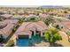 Aerial view of house and neighborhood, showcasing the community at 2599 E San Mateo Dr, Casa Grande, AZ 85194