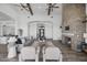 Spacious living room with an ornate entryway, fireplace, and seamless transition to the kitchen at 28484 N 91St Ave, Peoria, AZ 85383