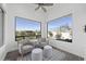 Bright sitting area with large windows offering views of the lush landscape at 28484 N 91St Ave, Peoria, AZ 85383