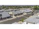 An aerial view captures a desert neighborhood with well-maintained homes, landscaping, and views of the surrounding area at 2929 E Broadway Rd # 44, Mesa, AZ 85204