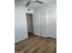 Simple bedroom with wood-look floors and ample closet space at 2929 E Broadway Rd # 44, Mesa, AZ 85204