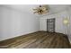 Bright bedroom features wood-look floors, a ceiling fan, and closet space at 2929 E Broadway Rd # 44, Mesa, AZ 85204