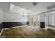 Dining room features wood-look floors, stylish chandelier, and patio access at 2929 E Broadway Rd # 44, Mesa, AZ 85204