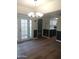 Bright dining room with chandelier and hardwood floors at 2929 E Broadway Rd # 44, Mesa, AZ 85204