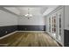Dining room features wood-look floors, stylish chandelier, and patio access at 2929 E Broadway Rd # 44, Mesa, AZ 85204