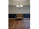 Elegant dining room with chandelier and wicker settee at 2929 E Broadway Rd # 44, Mesa, AZ 85204