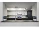 View of stylish kitchen with white and dark cabinets, stainless steel appliances, and subway tile backsplash at 2929 E Broadway Rd # 44, Mesa, AZ 85204
