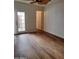 Bright living room with wood-look floors and access to a patio at 2929 E Broadway Rd # 44, Mesa, AZ 85204