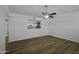 Inviting living area features wood-look floors, neutral paint, and modern ceiling fan for comfortable living and entertaining at 2929 E Broadway Rd # 44, Mesa, AZ 85204
