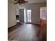 Spacious living area featuring wood-look floors and French doors at 2929 E Broadway Rd # 44, Mesa, AZ 85204