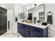 Modern primary bathroom with double vanity, large mirrors, and elegant fixtures at 36039 N 58Th St, Cave Creek, AZ 85331