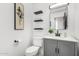 Cozy bathroom featuring a stylish vanity, toilet, and decorative wall art at 36039 N 58Th St, Cave Creek, AZ 85331