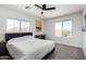 Bright bedroom with views of the landscape, a ceiling fan and a dedicated desk and work space at 36039 N 58Th St, Cave Creek, AZ 85331