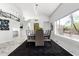 Dining room with marble floors, table for eight, and views of the outdoors at 36039 N 58Th St, Cave Creek, AZ 85331