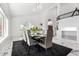 Open-concept dining area offers seating for ten, stylish decor, and high ceilings at 36039 N 58Th St, Cave Creek, AZ 85331