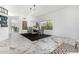 Bright dining room featuring elegant marble floors, modern lighting and neutral décor at 36039 N 58Th St, Cave Creek, AZ 85331