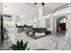 Bright living area featuring a leather sofa, modern design, and marble floors at 36039 N 58Th St, Cave Creek, AZ 85331