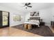 Bright main bedroom with an oversized picture window, a ceiling fan and private outdoor access to the back yard at 36039 N 58Th St, Cave Creek, AZ 85331