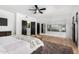 Spacious main bedroom featuring white walls, a ceiling fan, and views of the exterior through the large window at 36039 N 58Th St, Cave Creek, AZ 85331