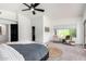 Main bedroom with ceiling fan, sitting area, and a neutral color palette at 36039 N 58Th St, Cave Creek, AZ 85331