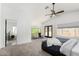 The main bedroom features a ceiling fan, sitting area, and ensuite bathroom at 36039 N 58Th St, Cave Creek, AZ 85331