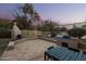 Outdoor kitchen and dining area with fireplace and mountain views at 36039 N 58Th St, Cave Creek, AZ 85331