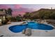 Freeform pool with a waterfall feature and mountain views at 36039 N 58Th St, Cave Creek, AZ 85331