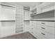 Spacious walk-in closet featuring custom shelving, drawers and hanging rods for optimal organization and storage at 36039 N 58Th St, Cave Creek, AZ 85331