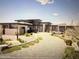 Modern home with sleek design, desert landscaping, and two-car garage at 36420 N 105Th Pl, Scottsdale, AZ 85262