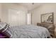 Well-lit bedroom featuring ample closet space at 4350 S Hudson Pl, Chandler, AZ 85249