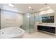 Modern bathroom with a large walk-in shower and soaking tub at 4401 E Sunset Dr, Phoenix, AZ 85028