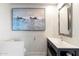 Modern bathroom with floating vanity and large art piece at 4401 E Sunset Dr, Phoenix, AZ 85028
