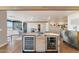 Island kitchen features wine cooler, built-in cabinetry, and granite countertop at 4401 E Sunset Dr, Phoenix, AZ 85028