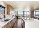 Modern kitchen with wood cabinetry, large island, and mountain views at 4401 E Sunset Dr, Phoenix, AZ 85028