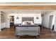 Spacious main bedroom with wood floors and en-suite bathroom at 4401 E Sunset Dr, Phoenix, AZ 85028