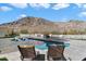 Relaxing pool area with mountain backdrop and comfortable seating at 4401 E Sunset Dr, Phoenix, AZ 85028