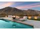 Relaxing poolside patio with fire pit and mountain views at 4401 E Sunset Dr, Phoenix, AZ 85028