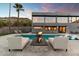 Stunning pool and patio with fire pit and modern furniture at 4401 E Sunset Dr, Phoenix, AZ 85028