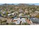 Wide aerial view of neighborhood, showcasing house and pool at 4601 E Solano Dr, Phoenix, AZ 85018