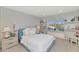 Bright bedroom with a comfy bed, built-in shelves, and window seat at 4601 E Solano Dr, Phoenix, AZ 85018