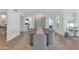 Modern dining room with light wood floors and large artwork at 4601 E Solano Dr, Phoenix, AZ 85018