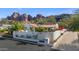 White stucco house with red tile roof, landscaped yard, and mountain views at 4601 E Solano Dr, Phoenix, AZ 85018