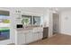 Modern kitchen features a farmhouse sink and backyard views at 4601 E Solano Dr, Phoenix, AZ 85018